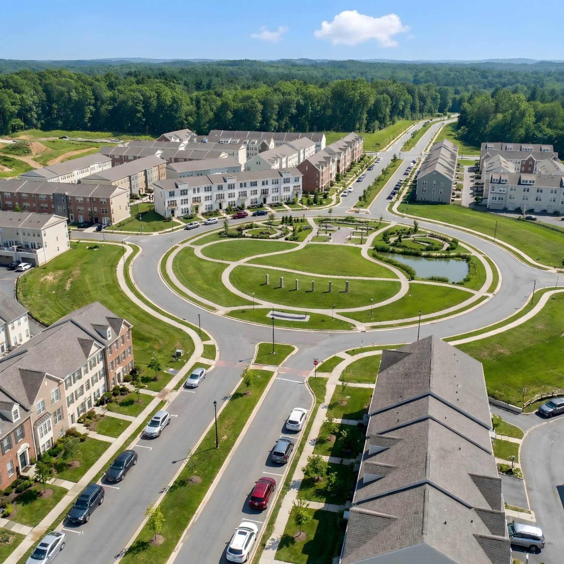 Aerial view of Westphalia Town Center with townhomes, winding roads, and green spaces